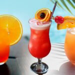 Aruba Ariba drink recipe: Tropical cocktail with rum and fruit, perfect for summer gatherings.